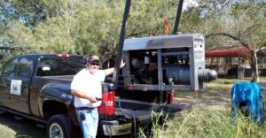 A man lifting heavy equipment with the Impac lift